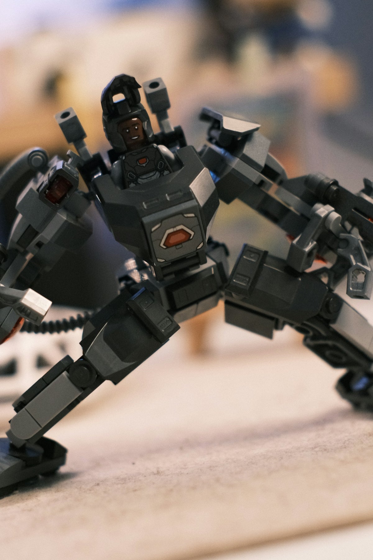 A dark gray robotic toy made of building blocks.